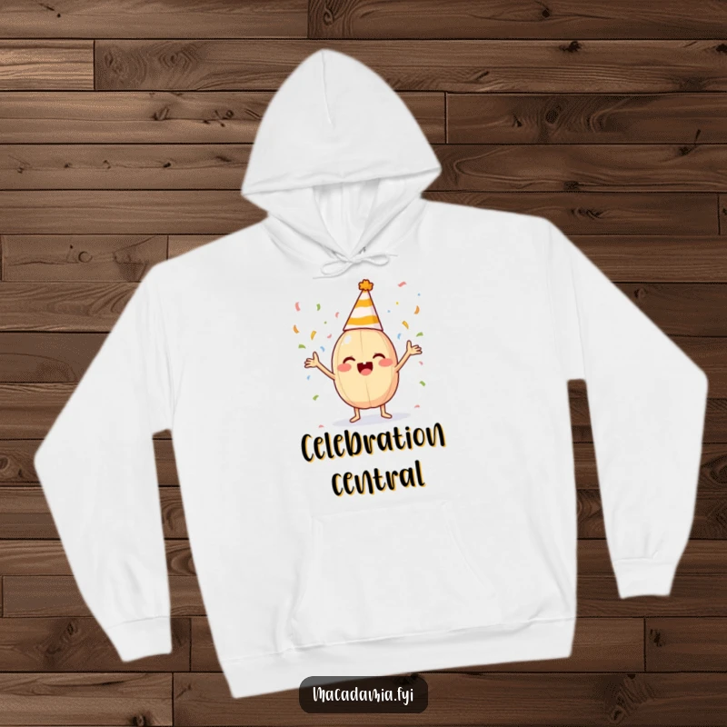 Funny macadamia nut with a party hat tosses confetti on a comfortable hoodie, ready to party.