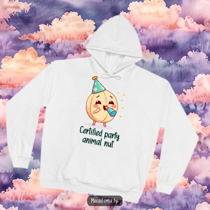 Funny macadamia nut wearing a party hat, enthusiastically blowing a noisemaker, depicted on a cozy hoodie for maximum cheer.