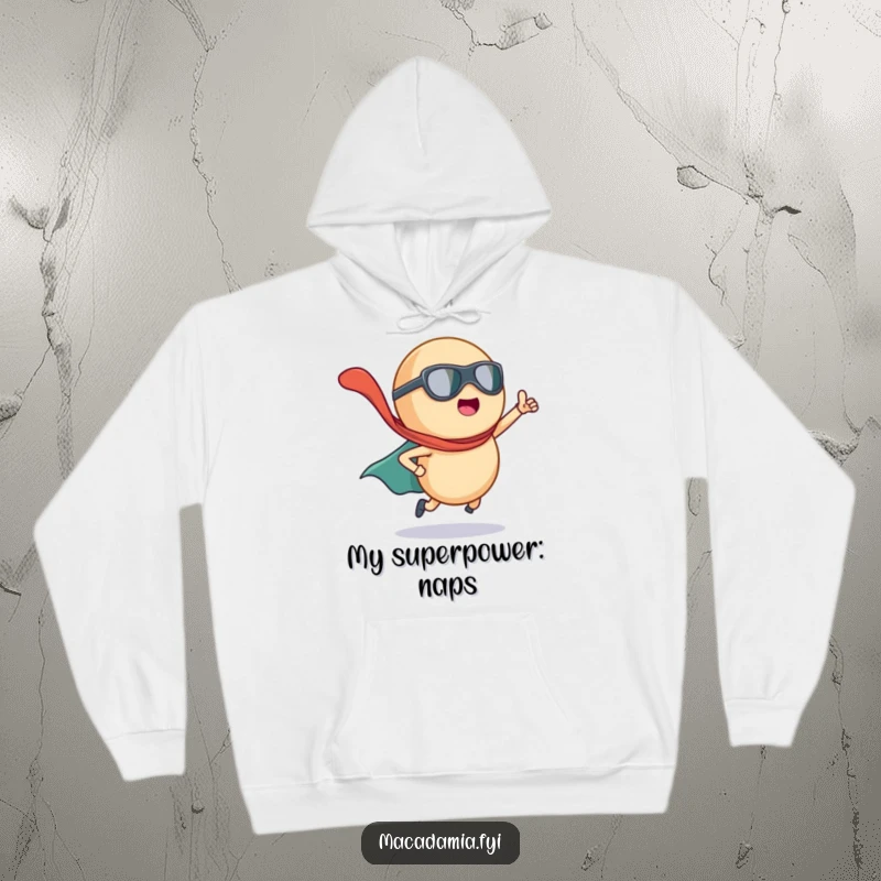 Funny macadamia nut superhero with a flowing cape, depicted on a cozy hoodie for heroic warmth and style.