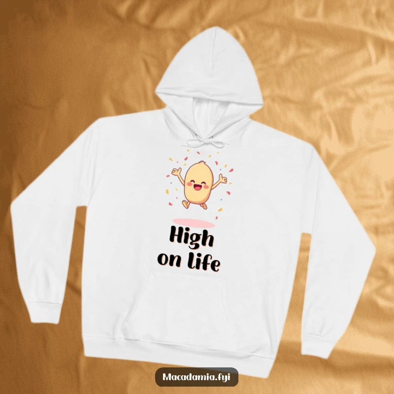Funny kawaii macadamia nut leaping with joy and tossing confetti in the air, perfect for this warm and humorous hoodie.