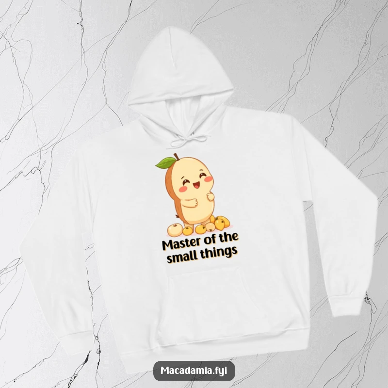 Funny macadamia nut giggling while balancing a stack of tiny fruits, depicted on a cozy hoodie for maximum amusement.