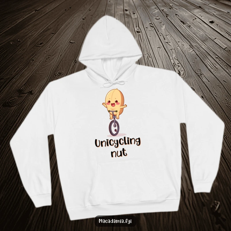 Funny macadamia nut character on a unicycle, looking cheerful, featured on a soft and cozy hoodie, perfect for warmth.