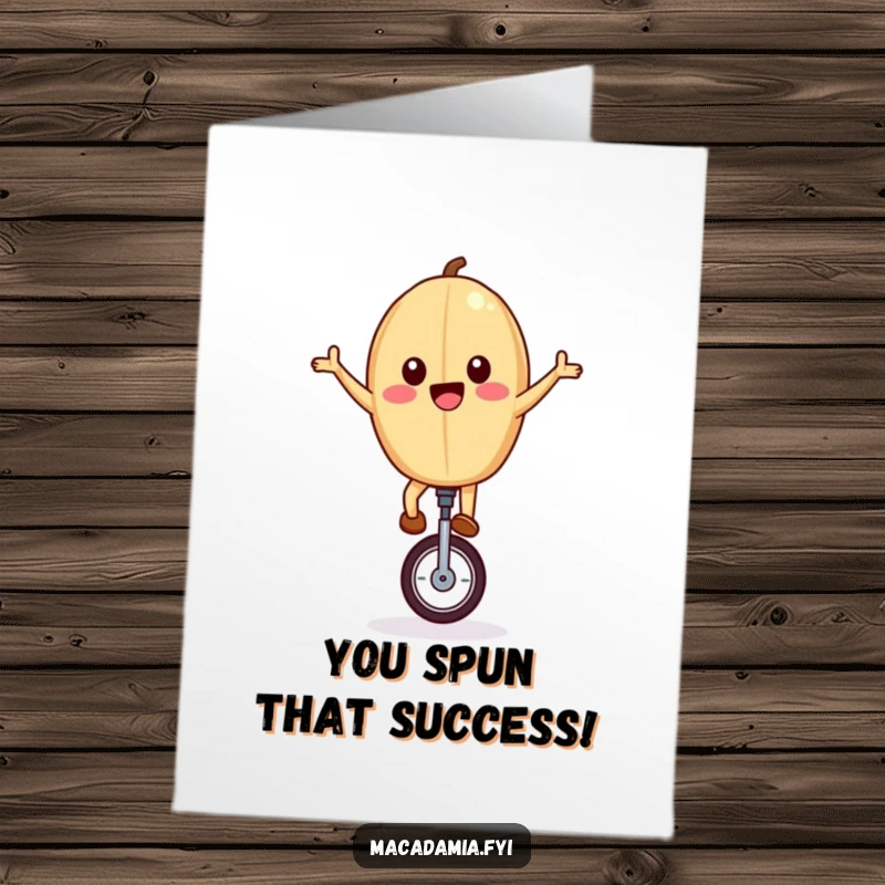 Funny Free Printable Congratulations Card: A macadamia nut joyfully riding a unicycle with arms wide, celebrating a win.
