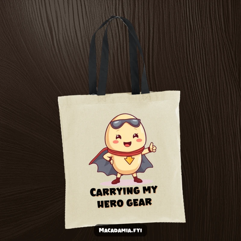 Funny Kawaii macadamia nut in a powerful superhero pose, cape billowing, featured on a stylish tote bag.