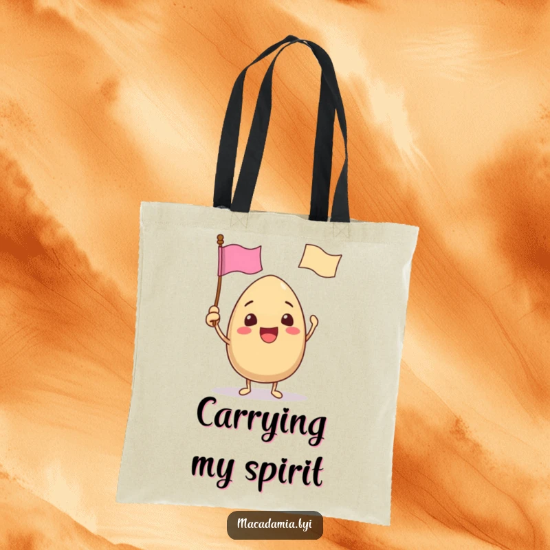 Funny tote bag with a macadamia nut character excitedly waving a tiny flag with a funny face, ready for festive outings.
